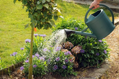 Worker using protective equipment during landscaping tasks